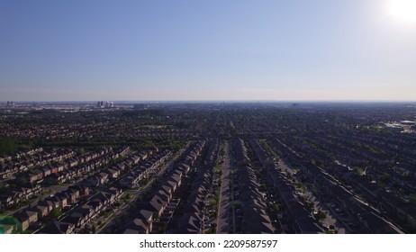 Panoramic View At Established Neighbourhood With Town Home Cottage Style Houses In Canada. Top Aerial View At Middle Class Family Homes With Large Backyard And Green Front Yards. Very Clean Area.