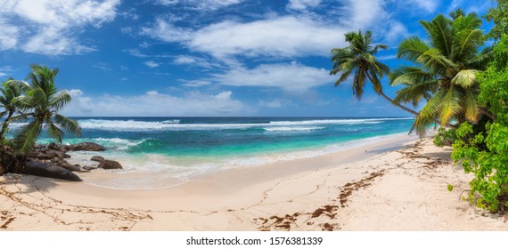 Panoramic view of exotic tropical beach and blue sea in Seychelles.  - Shutterstock ID 1576381339