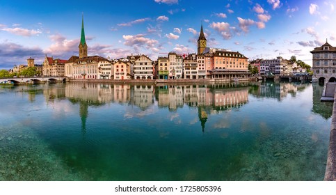 Panoramic view of famous Fraumunster, St Peter church and river Limmat at sunrise in Old Town of Zurich, the largest city in Switzerland
