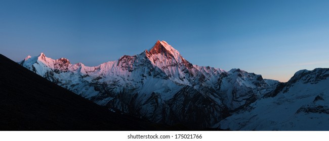 Panoramic view of  Fish tail or Machapuchare peak glows at sunset in the Himalayas, Nepal. - Shutterstock ID 175021766