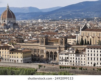 Panoramic view of Florence with historic buildings, iconic towers, and a river flowing through the city, set against a backdrop of rolling hills and a partly cloudy sky. - Powered by Shutterstock