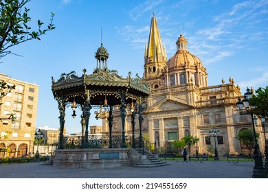 Panoramic view of the French Kiosk in the Plaza de Armas with the Government Palace of the State of Jalisco in the background on a beautiful morning