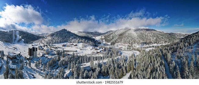 panoramic view of the french ski  resort "super lioran", snowy chalets in a valley surronded by mountains, winter landscape, france