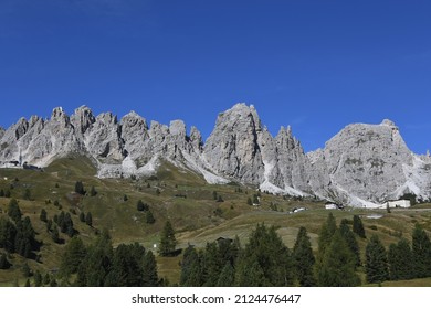Panoramic view of the Gardena Pass, Gardena Pass and the pass road in the South Tyrolean Dolomites. It connects Val Gardena in Val Badia and the municipalities of Selva, Corvara and Colfosco
