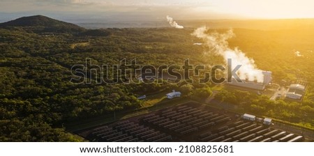 Panoramic view of the geothermal plants and solar panels of the Miravalles Volcano in Guayabo de Bagaces in Costa Rica with a beautiful sunset.	