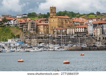 Panoramic view of Getaria, Spain, featuring the Gothic San Salvador Church (Salbatore Deunaren Eliza). A historic coastal town in the Basque Country with traditional architecture.