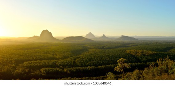 Panoramic view of Glass House Mountains (including Tibrogargan, Cooee, Beerwah, Coonowrin and Ngungun) at sunset in Queensland, Australia.