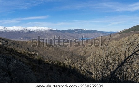 Panoramic view going up to the Morcuera pass and in the background the Pinilla reservoir and some of the most important snow-capped mountains. Madrid. 