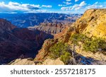 Panoramic view of Grand Canyon scenery from a viewing platform on the south rim near National Park visitor centre, Arizona, USA. Sunny spring day with clear view. Colorful and unique wild scenery.