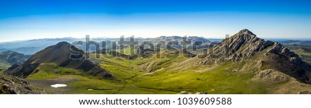 panoramic view of green fields whit montains in north spain south europe asturias cordillera cantabrica 