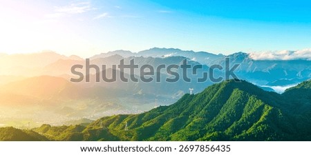 Panoramic view of the green mountain range and forest with beautiful mist natural landscape at sunrise