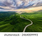 Panoramic view of the green mountains and hills at sunset. Gumbashi Pass in North Caucasus, Russia. Beautiful summer landscape