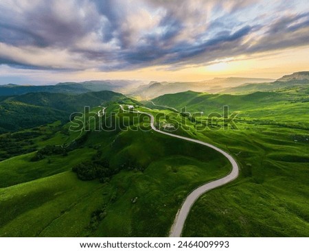 Similar – Image, Stock Photo Mountain landscape. Scenic view of mountain peaks, slopes, hills and valleys covered with grass and trees. Panoramic view. Natural scenery