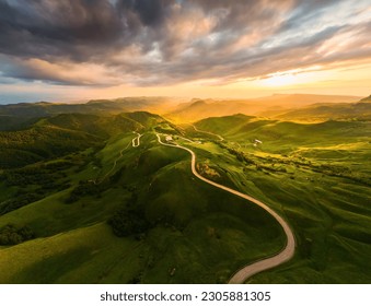 Panoramic view of the green mountains at sunset. Gumbashi Pass in North Caucasus, Russia. Summer landscape - Powered by Shutterstock