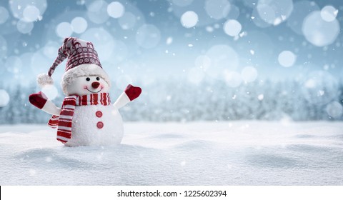 Panoramic view of happy snowman in winter scenery with copy space