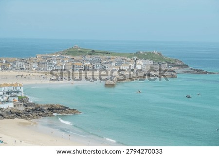 panoramic view of the harbor and sandy beach in the coastal town of St Ives, Cornwall.