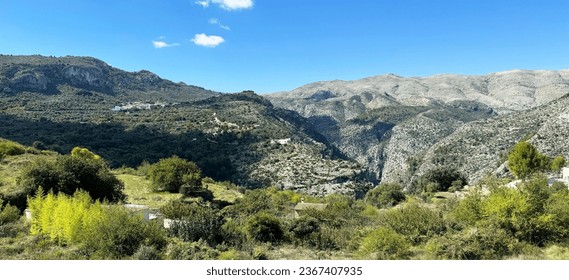 Panoramic view of the Hell's Ravine, or El Barranc de l'Infern, in La Vall de Laguar. One of the hardest hiking routes in Spain. The Cavall Verd mountain and the town Benimaurell are in the background