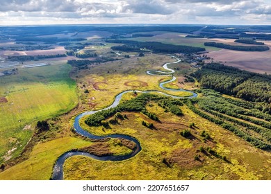 panoramic view from a high altitude of a meandering river in the forest - Powered by Shutterstock