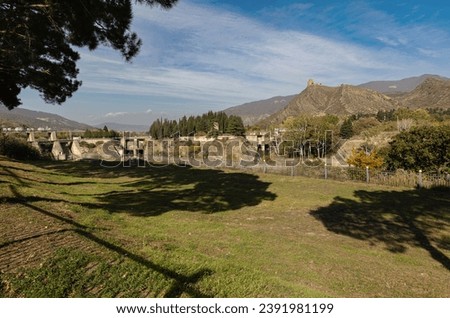panoramic view of the hill with the ancient Jvari monastery from the road to Mtskheta through the trees
