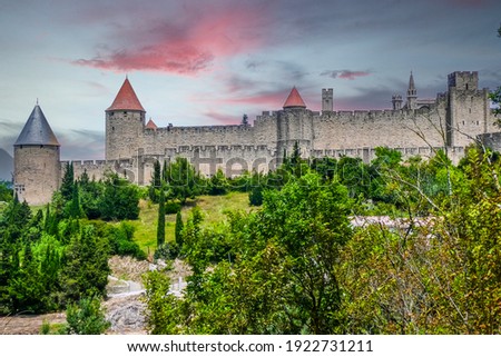 panoramic view of the historic center of Carcassonne surrounded by the walls of an old castle at sunset 