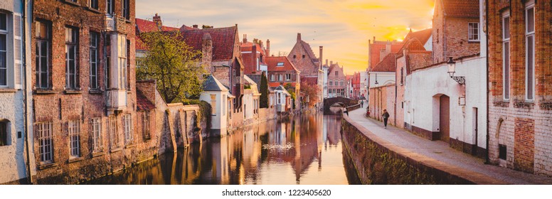 Panoramic view of the historic city center of Brugge in beautiful golden morning light at sunrise, province of West Flanders, Belgium