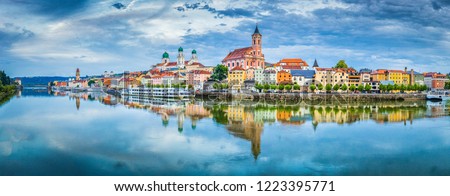 Panoramic view of the historic city of Passau reflecting in famous Danube river in beautiful evening light at sunset, Bavaria, Germany