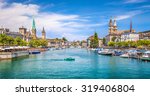 Panoramic view of historic Zurich city center with famous Fraumunster and Grossmunster Churches and river Limmat at Lake Zurich on a sunny day with clouds in summer, Canton of Zurich, Switzerland