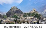 Panoramic view of historical Sion town with its two castles, Chateau de Tourbillon and Valere Basilica, spectacular set in the swiss Alps mountains valley, canton Valais, Switzerland