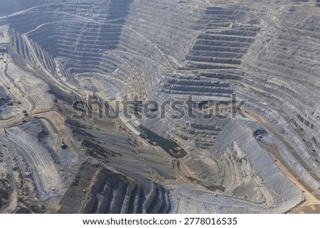 Panoramic view of a huge open-pit mine in mineral extraction operations