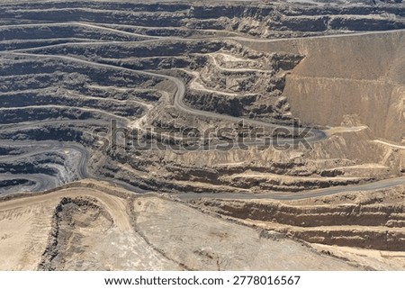 Panoramic view of a huge open-pit mine in mineral extraction operations