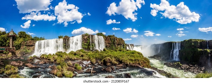 Panoramic view of the Iguazu Falls, border between Brazil and Argentina. The falls are one of the seven wonders of the world and are located in the Iguaçu National Park, a UNESCO World Heritage Site.