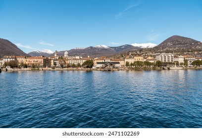 Panoramic view of the Intra town from Lake Maggiore with snow-capped mountains in the background, Verbania, Piedmont, Italy - Powered by Shutterstock