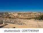 Panoramic view of Jerusalem view from the Mount of Olives featuring a Jewish cemetery and the Old City with the Temple Mount and the Dome of the Rock