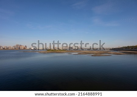 Panoramic view of Kazan in spring, Russia. The Kazanka river, on which the city is located, with comfortable embankments. Panoramic view of Kazan city under blue sky from Kremlin.