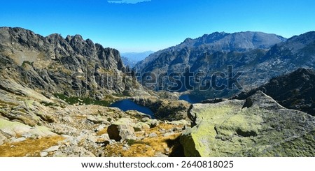 Panoramic view of Lac de Capitello, Lac de Melo and Restonica valley taken from the high mountain pass Brèche de Capitello (GR 20 hiking trail, Haute-Corse, Corsica)