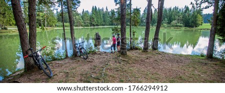 A panoramic view of Lake Bloke surrounded with trees reflecting on the lake