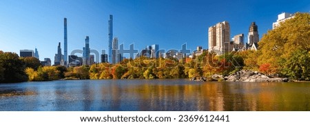 Panoramic view of The Lake in Central Park with Billionaires' Row skyscrapers and Upper West Side buildings. Autumn morning in the Central Park West Historic District. Manhattan, New York City