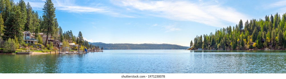 A panoramic view of Lake Coeur d'Alene, Idaho, USA with waterfront homes, docks and marina at Rockford Bay.	