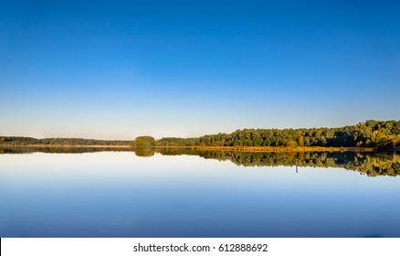 A Panoramic View Of Lake Crabtree In North Carolina Triangle Showing The Clear Blue Sky Mirrored By Its Clear And Still Waters. This Park Is Just Few Miles Away From Duke University.