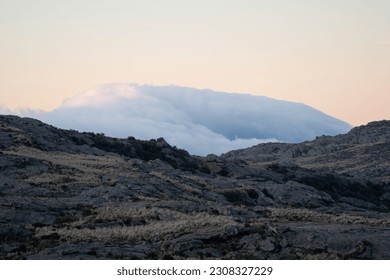 Panoramic view with layers generated by the mountain landscape, sky with clouds, no people.