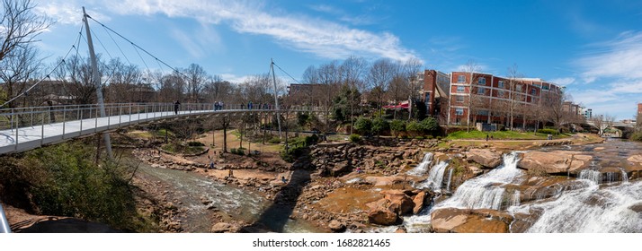 A panoramic view of the Liberty Bridge crossing the Reedy River Falls in Greenville, South Carolina