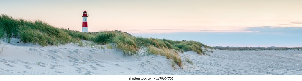 Panoramic view of a lighthouse standing at the coast of Sylt, North Sea, Germany - Powered by Shutterstock