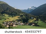 Panoramic view of little town Breil/Brigels, Switzerland with Sogn Sieve church in the middle