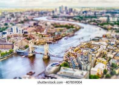 Panoramic View of London, over the river Thames towards Canary Wharf and Eastern London. Tilt-shift effect applied - Shutterstock ID 407859004