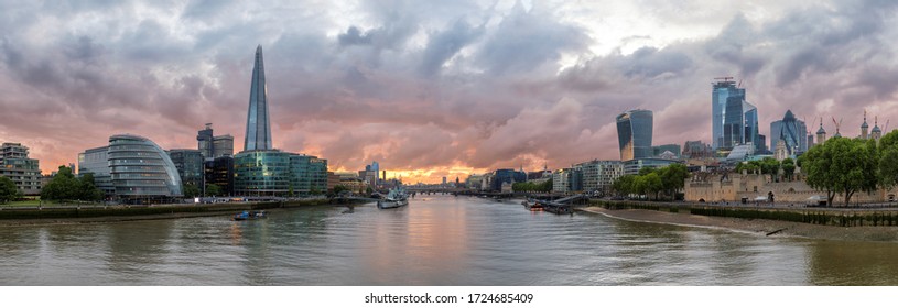 Panoramic view of London skyline along the Thames river during sunset time, London, United Kingdom.
