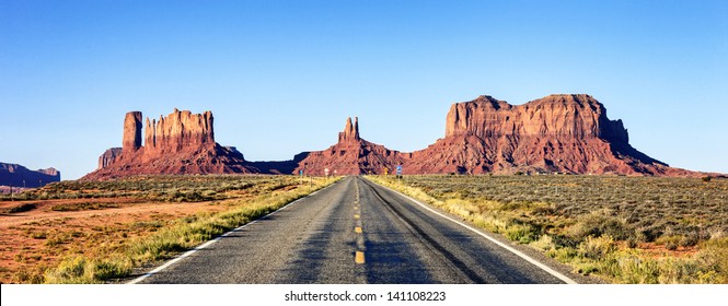 Panoramic View Of Long Road At Monument Valley, USA