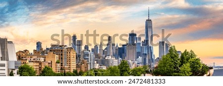 Panoramic view of Lower Manhattan skyline at sunset, behind the Little Island public park.