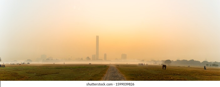 Panoramic View of Maidan Play ground at Kolkata,India in a foggy Winter morning with Silhouette people.  - Shutterstock ID 1599039826
