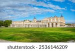 Panoramic view of the Main facade of the Royal Palace of Aranjuez, a historical residence of the Spanish monarchy, with its expansive gardens and elegant architecture. Aranjuez, Madrid, Spain.