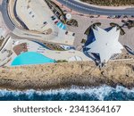 Panoramic view of Malta National Aquarium (Located in Qawra) and an incredibly beautiful beach. San Paul il Bahar (San Pawl il-Baħar). Bugibba. Aero Photography. View from flying drone. St Paul